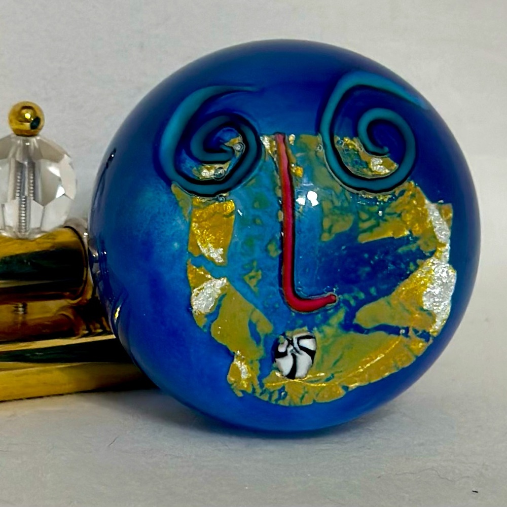 Fineline studios glass paper weight. Kerry Feldman. Abstract face.